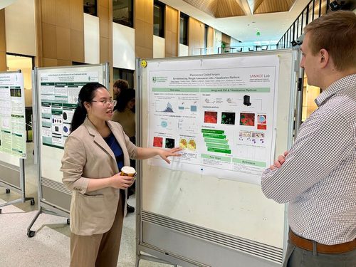 A BME student presents her poster at the "Research-in-Progress" symposium.