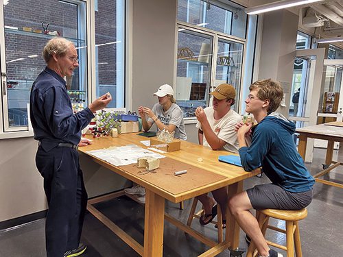 Professor Levey with three students in the lab