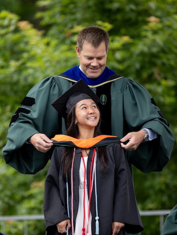 Van Citters hoods a graduate