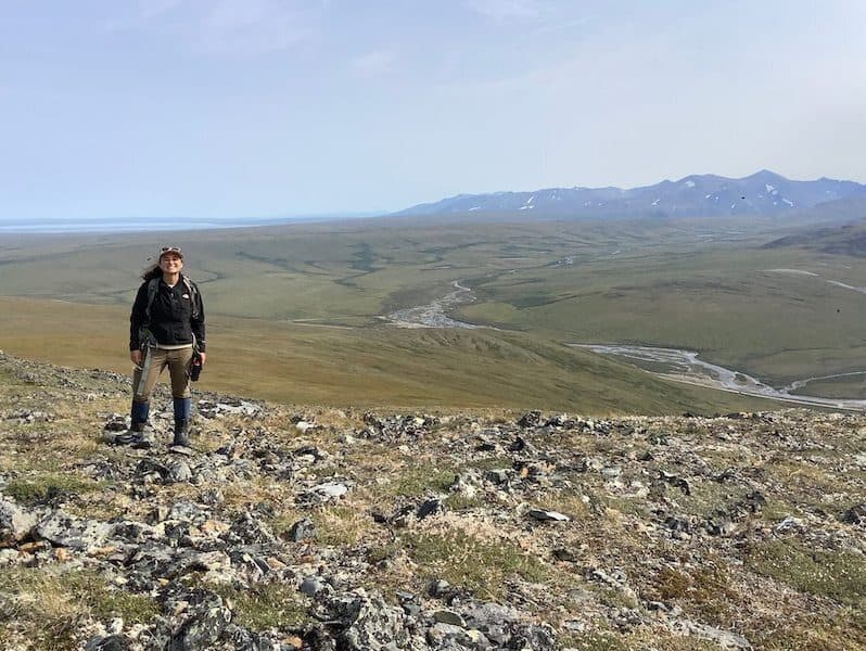 Joanmarie Delvecchio stand atop permafrost in study of Arctic