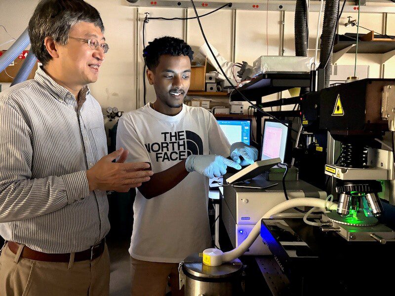 Professor Jifeng Liu and Gideon Kassa in lab