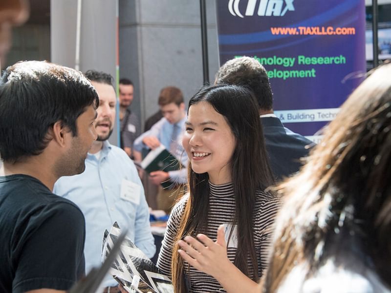 Students engage with employers about internship opportunities.