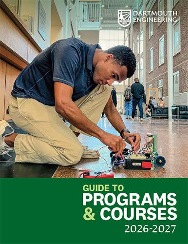 A student wiring a robot appears on the cover of the 2026-2027 Guide to Programs and Courses.
