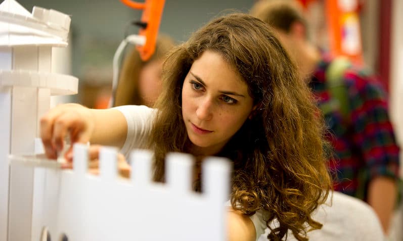 A student works on a large model for a student independent project grant