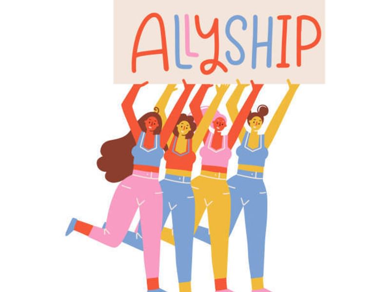 Group of people holding a sign that says 'ALLYSHIP.'